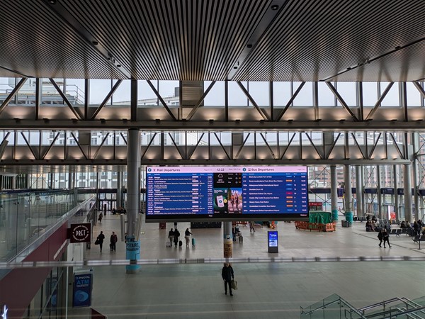 Image of departure board and wider station