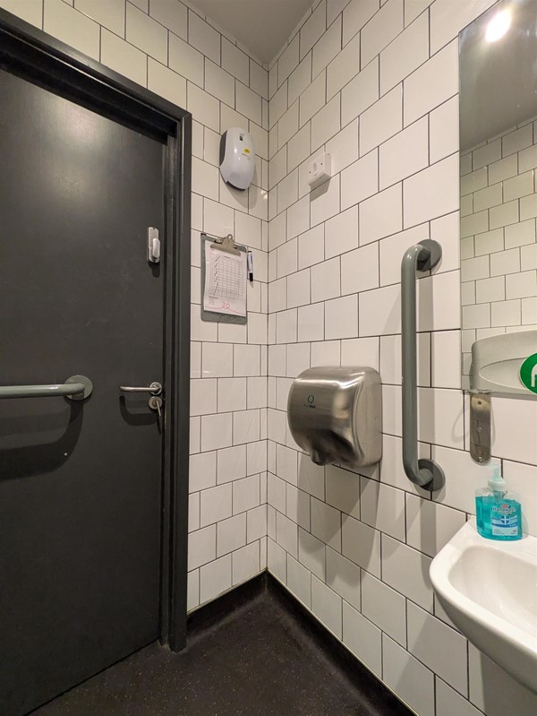 Image of door from the inside - there's a handdryer to the right