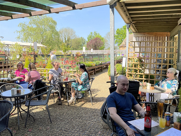 Image of people in an outdoor dining area