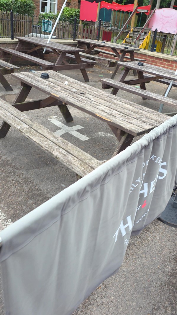 Second accessible parking space with benches blocking use.