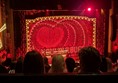 Close-up of the stage from the accessible seating area. The stage lighting and colours look spectacular.