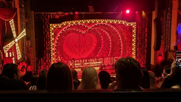 Close-up of the stage from the accessible seating area. The stage lighting and colours look spectacular.