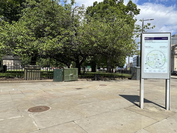 Image of park from outside with information board