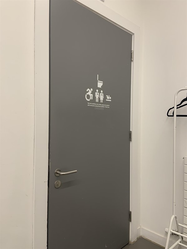 image of the outside of accessible bathroom door