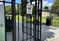 Image of ‘No dogs except for guide dogs’ sign on entrance gate