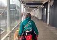 Image of a wheelchair user and assistance dog at Bristol Airport