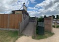 Picture of a ramp going up to the toilet block