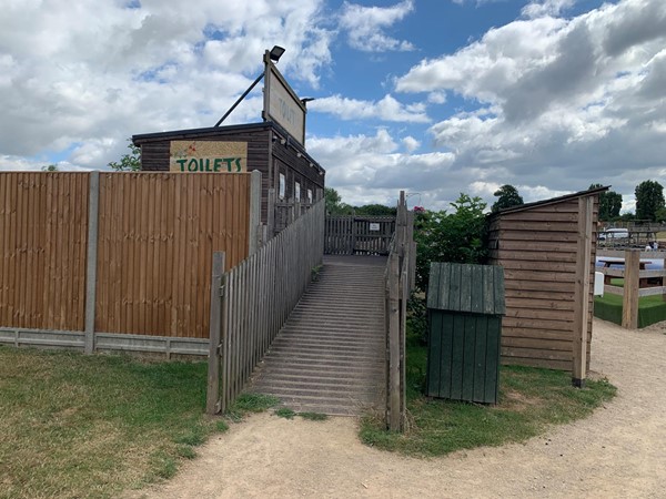 Picture of a ramp going up to the toilet block