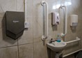 Sink with grab rails and hand dryer