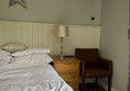 Image of a bed and bed side table