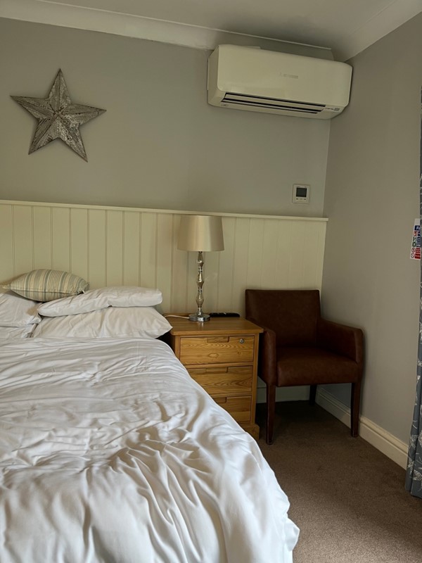 Image of a bed and bed side table