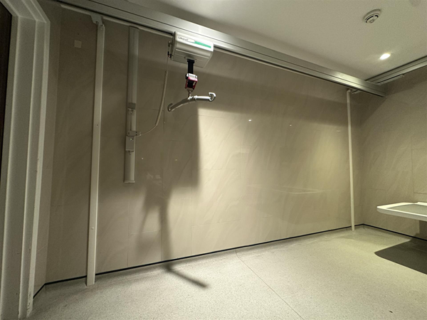 Image of ceiling hoist and remote to operate