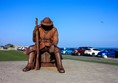 One of the car parks (in town) is fairly flat and has a copper man on a flat paved surface.