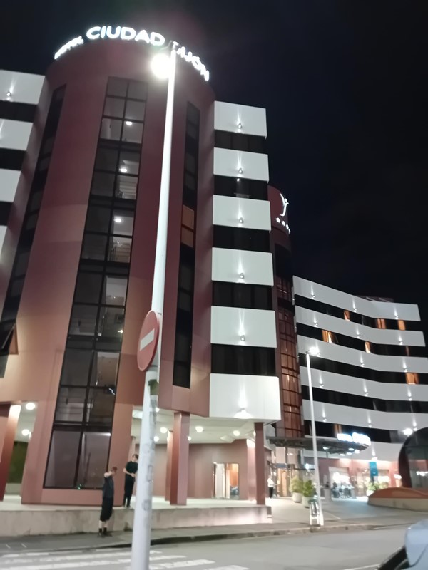 Image of a building with a street sign