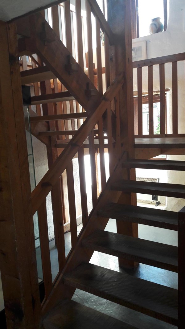 Stairs to first floor studio.