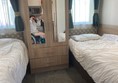 Twin room - Wider beds than other caravans and room for the portable hoist provides
