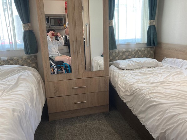 Twin room - Wider beds than other caravans and room for the portable hoist provides