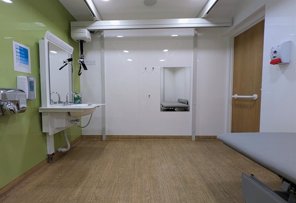 Image of sink and ceiling hoist in large Changing Places accessible toilet