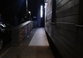 Ramp to main entrance with good surface and lighting.