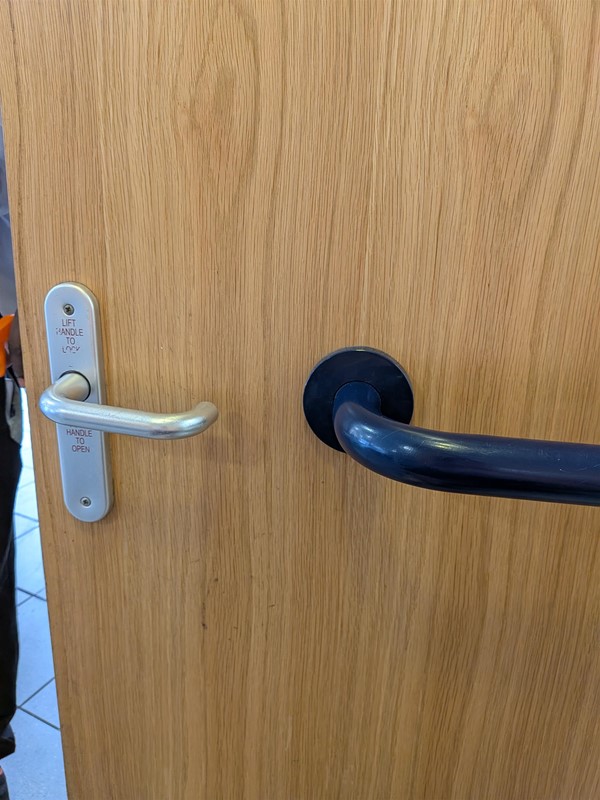 image of the inside of the door to the accessible bathroom