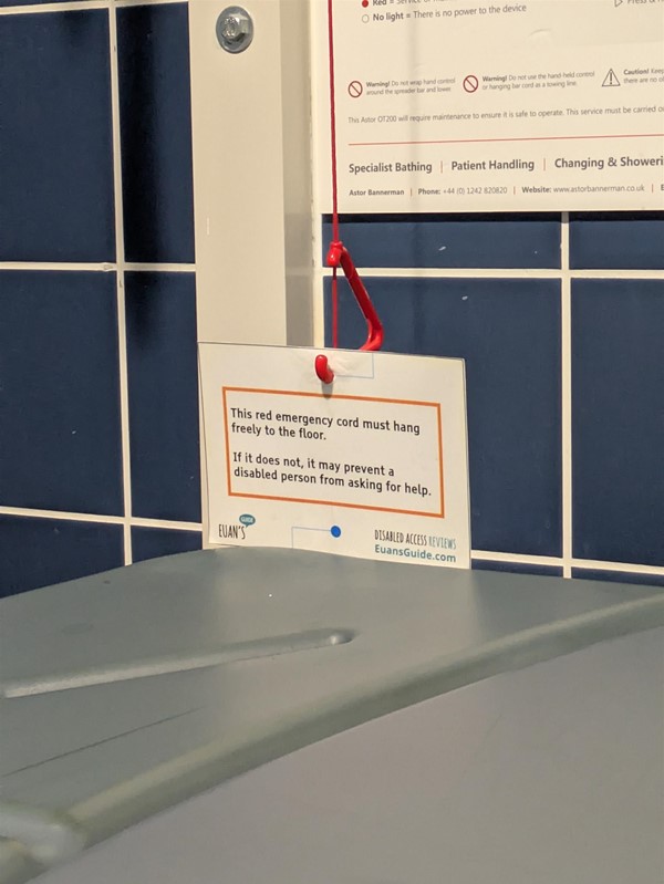 Image of a Red Cord Card on a red cord