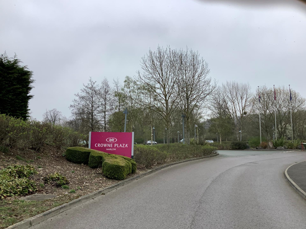 Picture of road leading to hotel showing the sign for the hotel