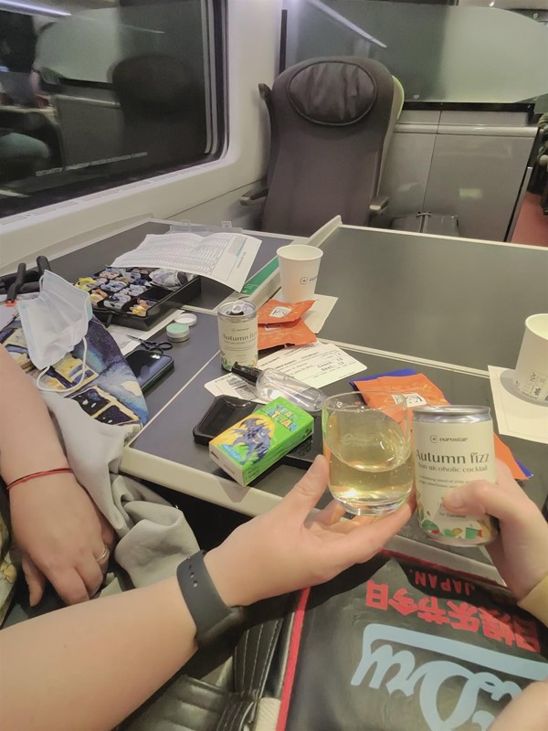Image of food and drink on a table on a train