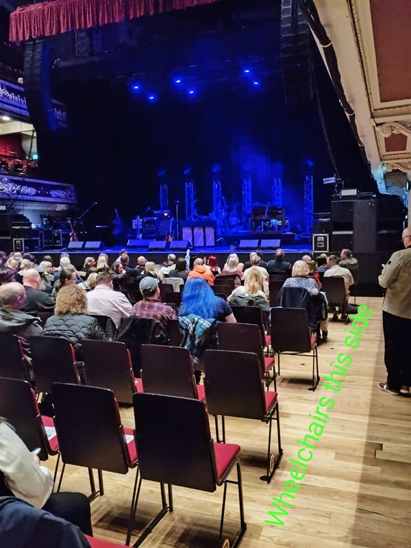 Picture of an audience facing a stage