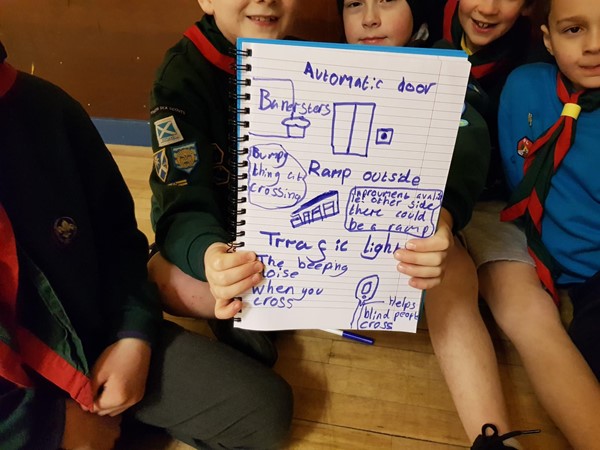Photo of cubs holding up their notes