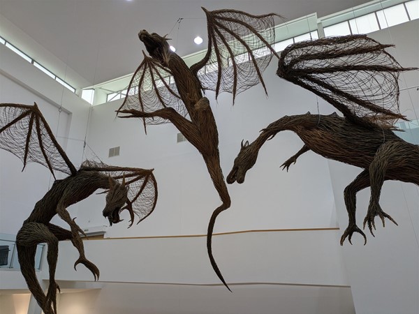 Image of dragon figures hanging from the ceiling.