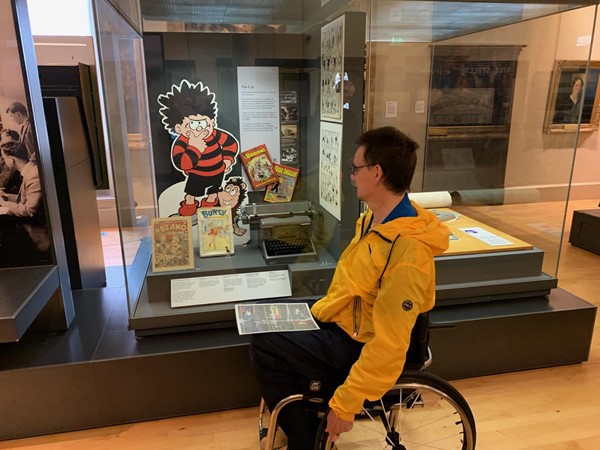 Paul looks at a cabinet telling the story of his favourite characters from the Beano comic
