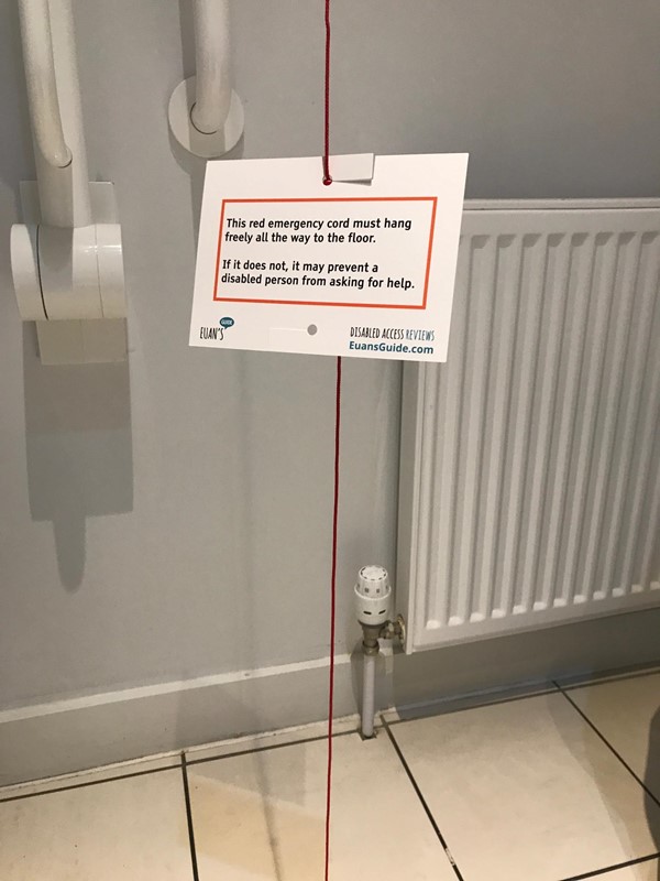 Accessible Toilet with red cord card