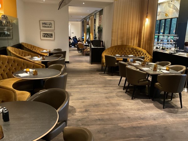Image of a room with tables and chairs