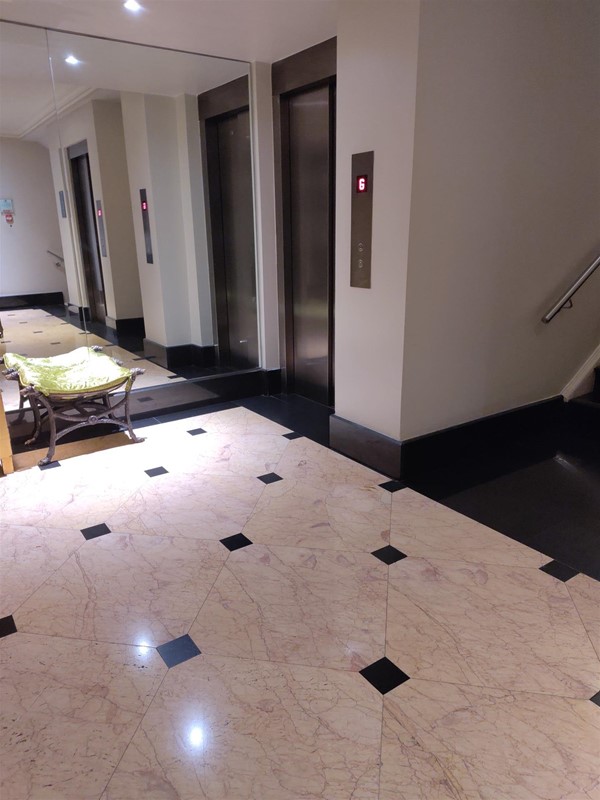 Lift, with obstructive furniture outside.