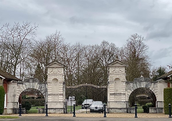 Image of a gate with white brick pillars