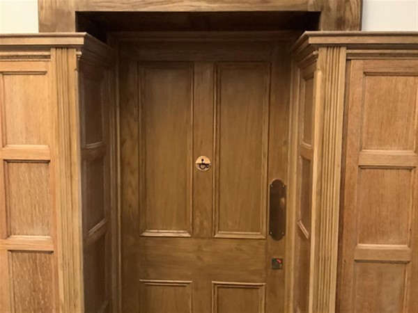 Image of an accessible toilet door.
