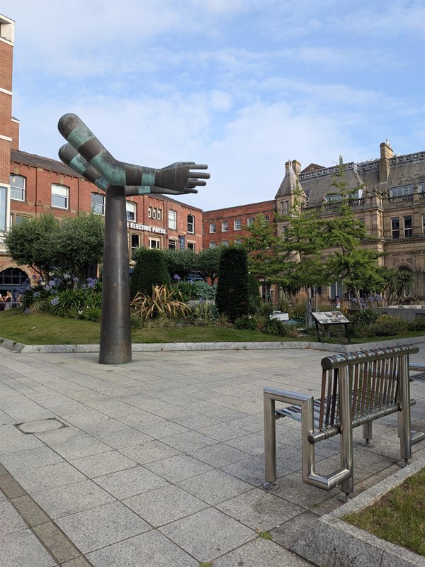 image of bench and sculpture