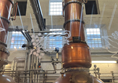 Two of the smaller stills used to create Bombay Sapphire gin.  We went into the room to see them more clearly, but could not take photos in there due to danger of explosions from sparks.  This photo was taken through a glass wall.