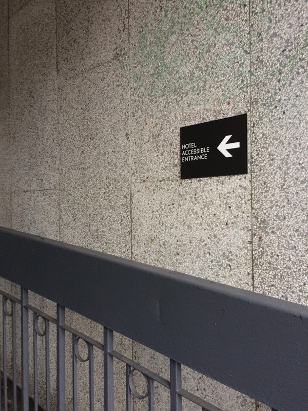 Sign showing the accessible entrance route