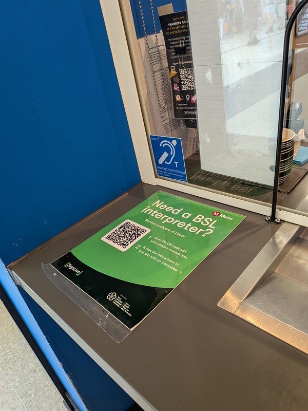 image of BSL signage at the Travel Centre counter