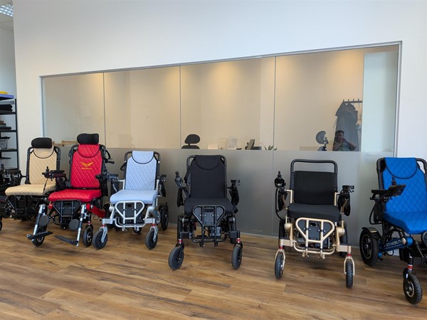 image of power chairs on display and an interior window into the office