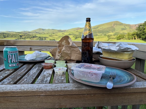 Take away from the local curry house on the decking outside the hut.