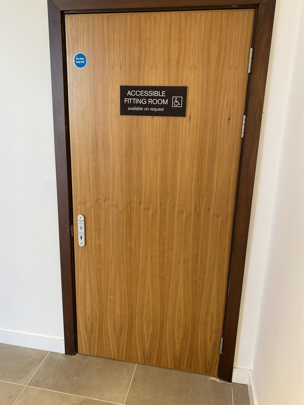 Image of an accessible fitting room door