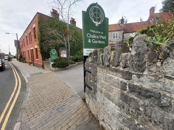 Sign saying "Welcome to Chalice Well & Gardens"