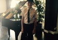 Picture of The Brighton Hotel - Child in a hat and tie standing in front of a piano