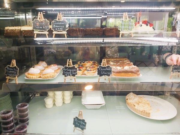 Image of a display case with pastries and desserts