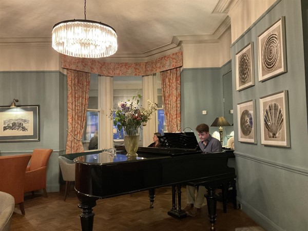 Image of a person playing a piano