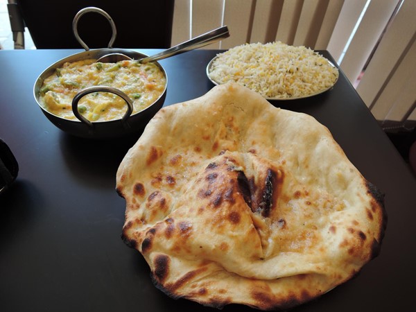 vegetable korma, pilau rice and garlic naan bread