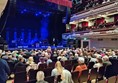 Picture of an audience facing a stage