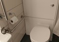 There is a left rail also, it's hidden by the shower curtain